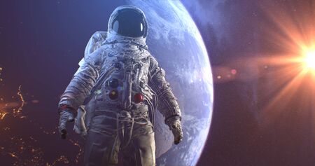 Astronaut Neil Armstrong, spacewalk on the Moon surface watching planet Earth from space.の写真素材