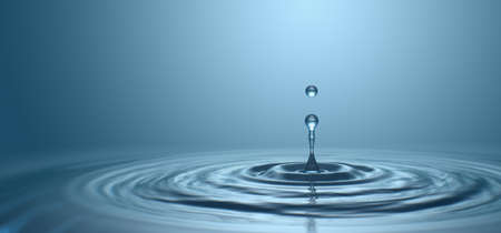 Water drop with droplet and rings on surface bluish backgroundの写真素材