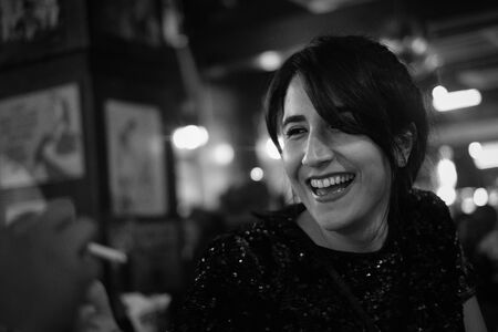 Black and white candid portrait of smiling beautiful young iranian persian girl.の写真素材