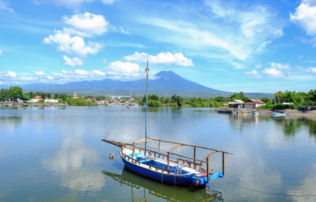 Lake and Boat in Banyuwangi with mountain view