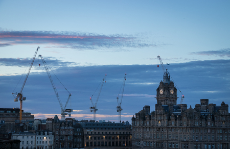 cranes in edinburgh at sunsetの写真素材