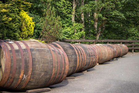 whiskey barrels outside in a scottish distilleryの写真素材