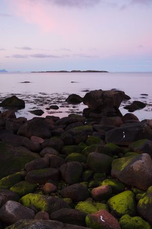 Strange green stones at night in the lofoten islands (norway)の写真素材
