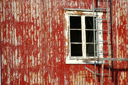 Red rustic house damaged in the lofoten islandsの写真素材