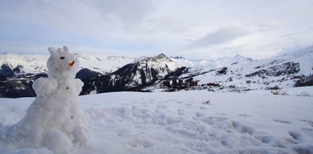 snowman and mountainsの写真素材