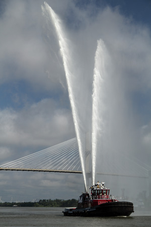 A tugboat makes its way down the Savannah River, Savannah, Georgia