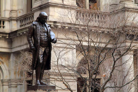 A statue of Benjamin Franklin graces the grounds of Old City Hall in downtown, Boston, Massachusettsのeditorial素材