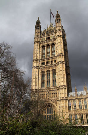 The Victoria Tower, which is perhaps the most recognizable part of the Palace of Westminster, stands out against a grey London skyのeditorial素材