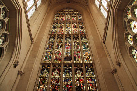 The elaborate interior of Bath Abbey contains numerous stained glass windows that depict events and people in the history of Christianityのeditorial素材