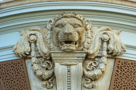 Stone lion facade decoration on grand palace wall, Wat Prakeaw, Thailand の写真素材