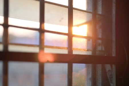 Sun shines through the window in the morning の写真素材