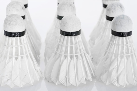 Old shuttlecock on white background の写真素材