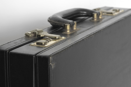 Close up old suitcase on white background の写真素材