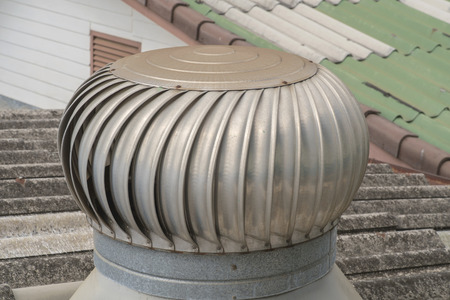 Rusty air ventilator on the roof of factory.