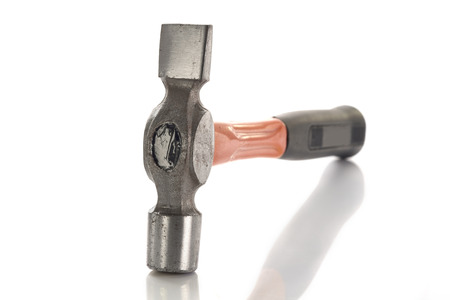 Close up old hammer on white background.の写真素材