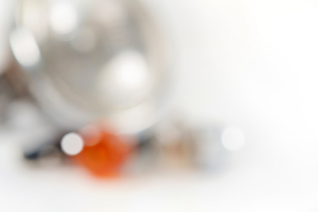 Blur of headlight and turn signal of motorcycle on white background.