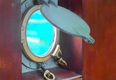 Window or porthole of boat with blur ocean view.の写真素材