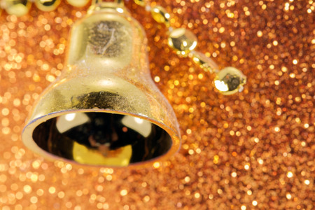 Small bell on glitter paper.の写真素材
