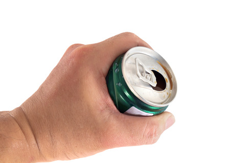 Coffee can in hand on white background.
