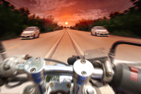 View of sunset from the riders, motion blurred. Orange halftone.の写真素材