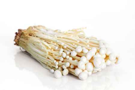 Enoki mushroom on white background.