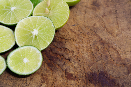 Lime slice on wood background.の写真素材