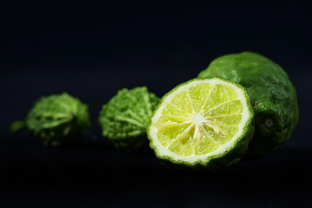 Ripe bergamot on black background.の写真素材