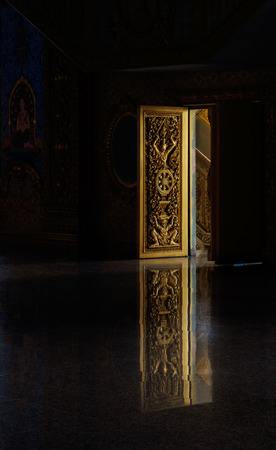 Decor door of temple open with reflex of door, Wat Yai Chai Mongkol, Roy Ed, Thailand.Dark tone.の写真素材