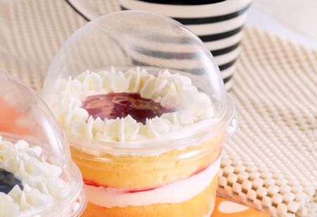 Cupcakes in plastic container on the table.の写真素材