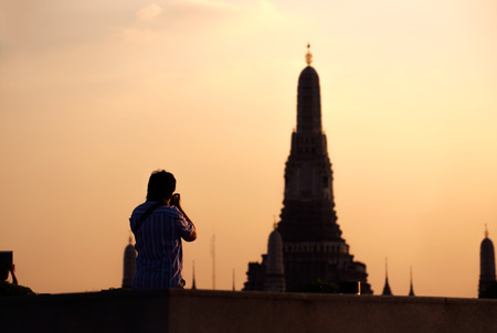 Silhouette of photographer taking photo of Wat Arun.の写真素材