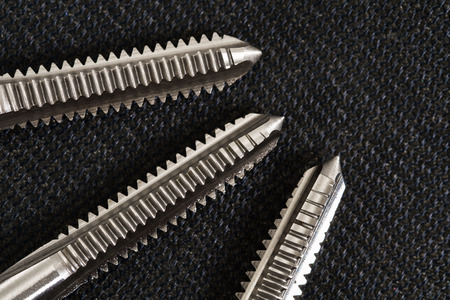 Hand tap (threading tool) on nylon background.の写真素材