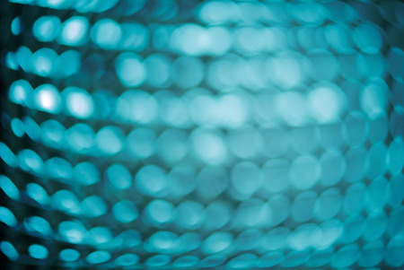 Abstract blur background of aluminum foil. Blue tone.