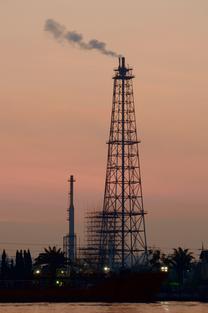 Silhouette of oil refinery in the morning.の写真素材