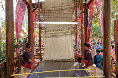 Bangkok,THAILAND, JANUARY 15 : Native Women Unknown Demonstrating weaving, Thailand Tourism Festival...