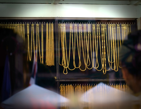 View of window display of gold shop.の写真素材