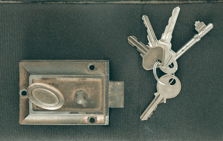 Old door knob and keys on nylon background. Vintage style. Top view.の写真素材