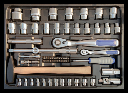 Set of old mechanic tool in box on black background. Top view. Flat lay.の写真素材