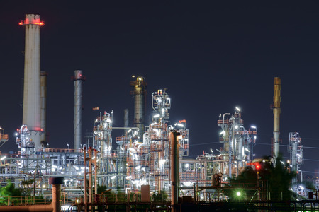 View of oil refinery at night.