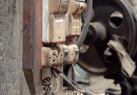 View of old and dirty plug and switch in the factory.