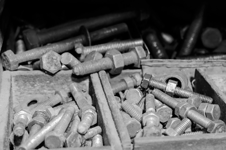 View of dirty nuts and bolts in the factory. Black and white tone.の写真素材