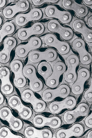 Abstract background texture of old and dirty roller chain for motorcycle. Top view.の写真素材