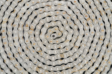 Abstract background texture of dirty roller chain. Top view.