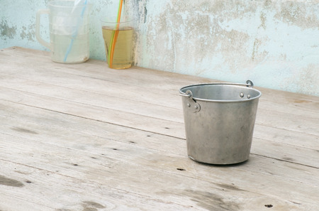 View of aluminum container on wood table.の写真素材