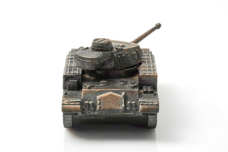 Vintage toy, military tank on white background.の写真素材