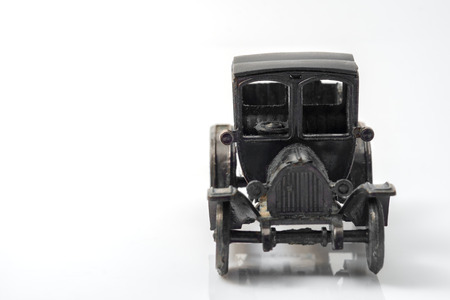 Toy vintage car on white background.の写真素材