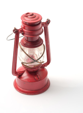 Vintage toy, kerosene lamp on white background.の写真素材