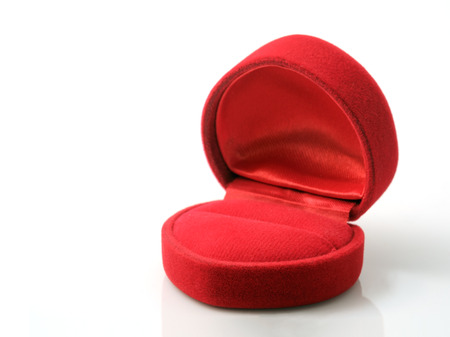 Empty red wedding ring box on white background.の写真素材