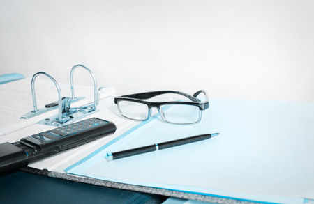 View of business office desk. Blue tone.の写真素材