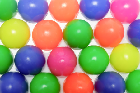 Abstract colorful background of plastic eggs toy. Top view.の写真素材