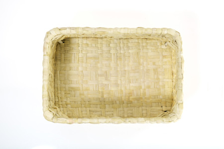 View of wicker basket on white background. Top view.